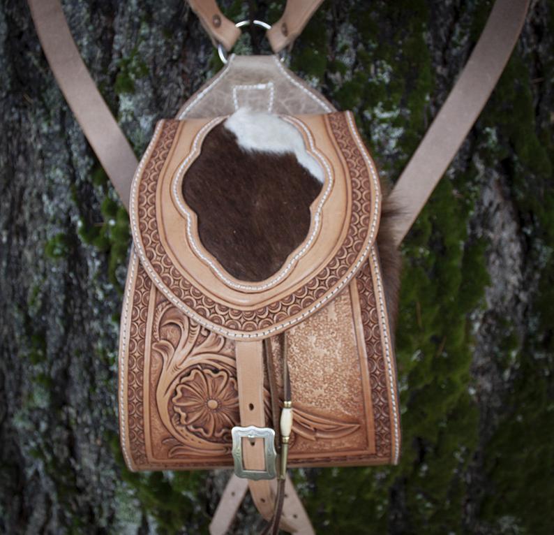 Purse, hand tooled leather back pack purse with hair on cowhide gussets and inlay